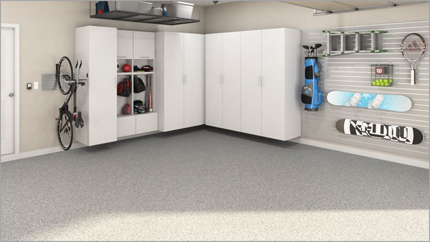 Custom Garage with epoxy flooring, Storage cabinets and slatwall systems