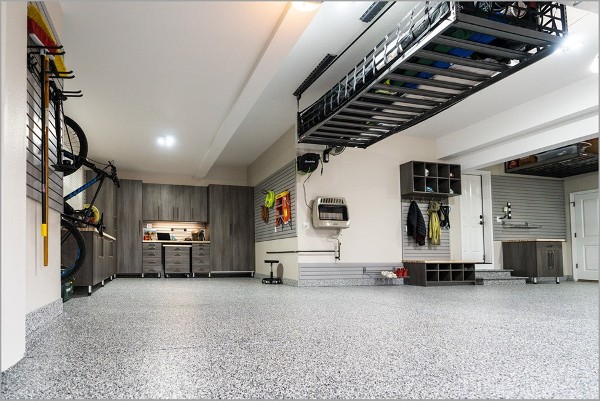 custom garage with cabinets, overhead storage and wall-hanging systems