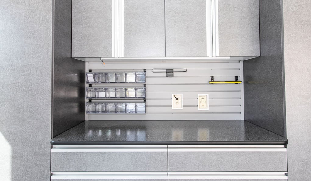 Gray-leather-textured-cabinets-slatwall-closeup